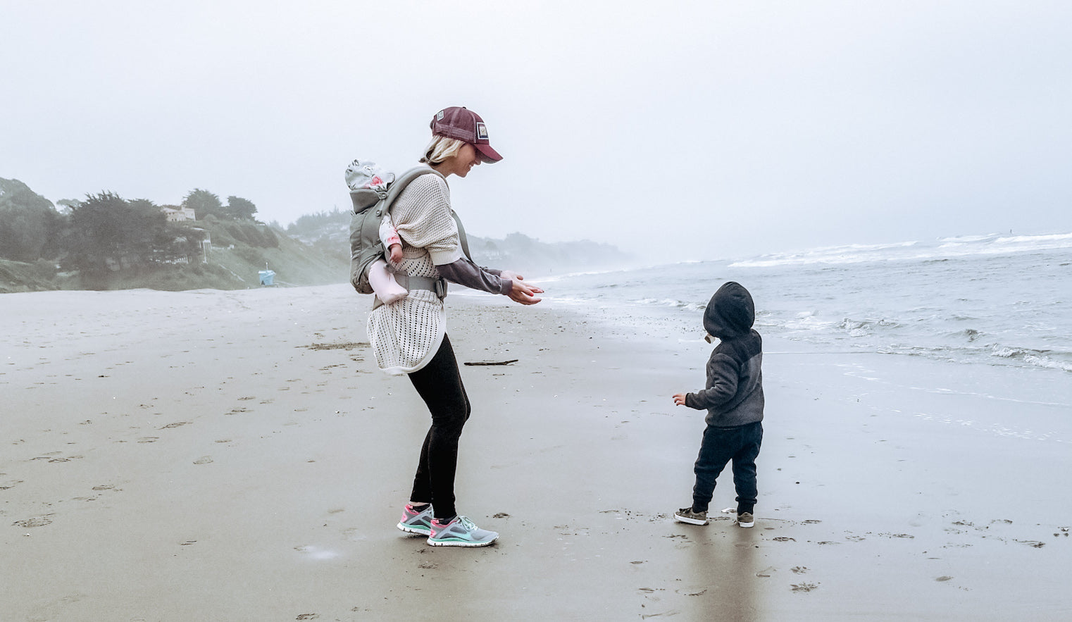 Mom and son walking on beach with bigtruck hat